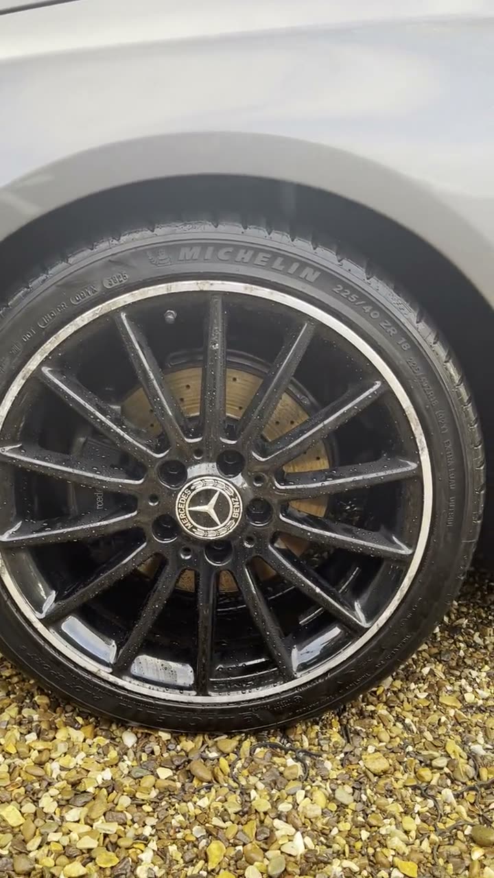 The same Mercedes alloy wheel cleaned back to a deep black finish
